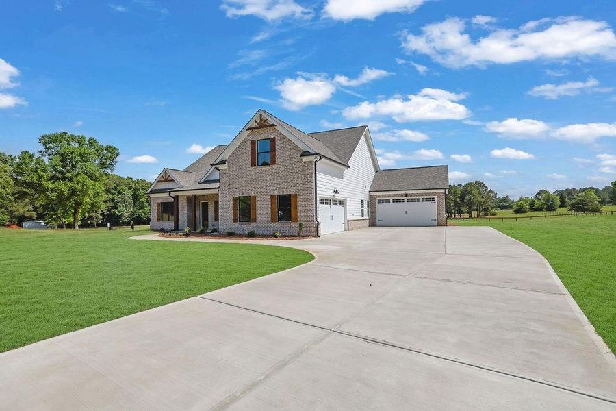 Front exterior of a new home in , Monroe, GA, highlighting curb appeal (Image 1). Front exterior of a new home in , Monroe, GA, highlighting curb appeal (Image 1).