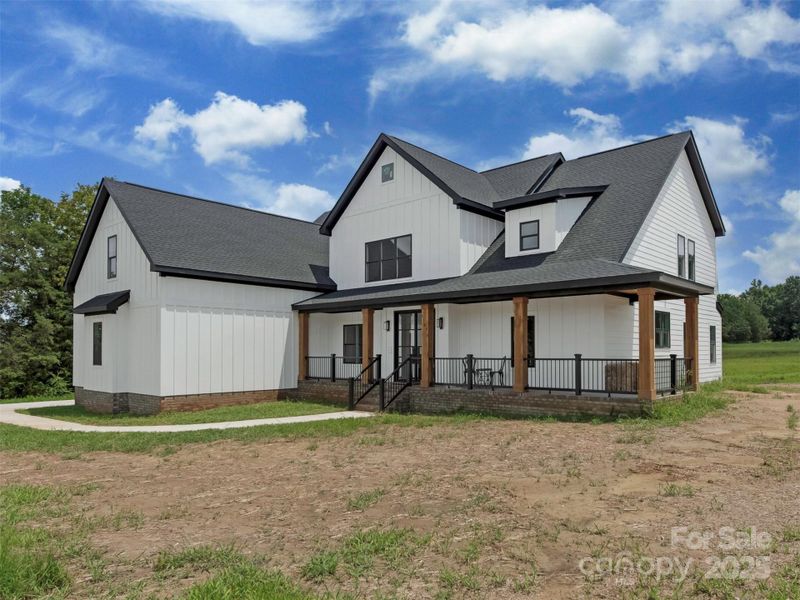 Front exterior of a new home in , Waxhaw, NC, highlighting curb appeal (Image 23).