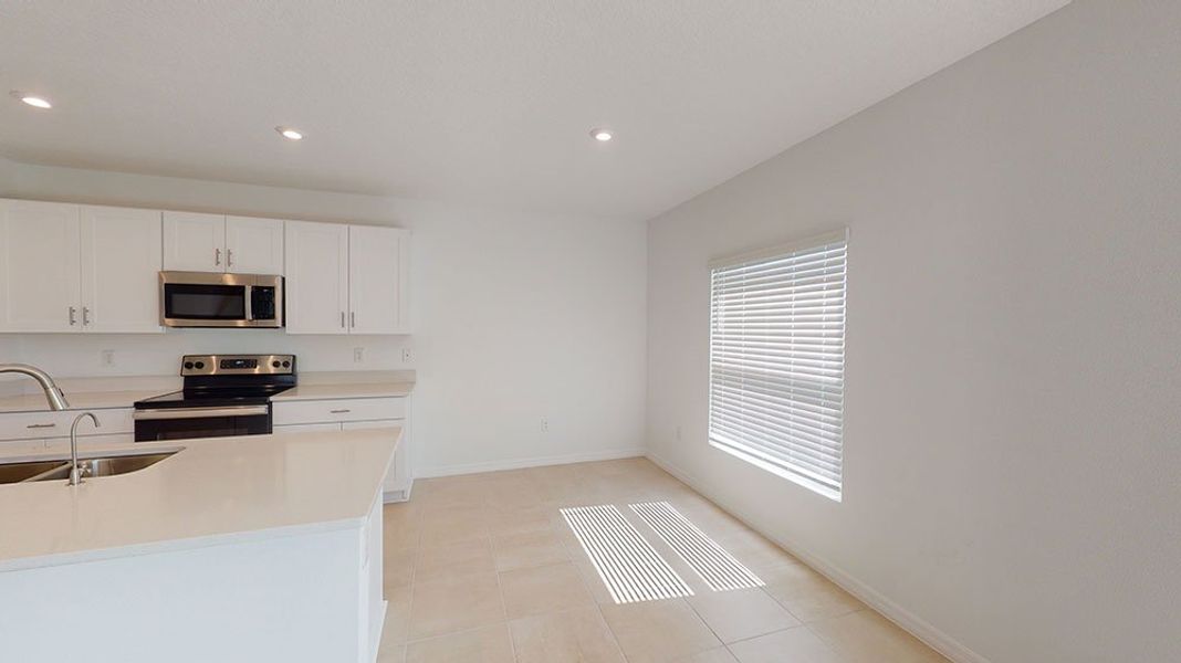 Representative furnished interior of a home built from the Azalea by Taylor Morrison in Riverfront, Edgewater (Image 5).
