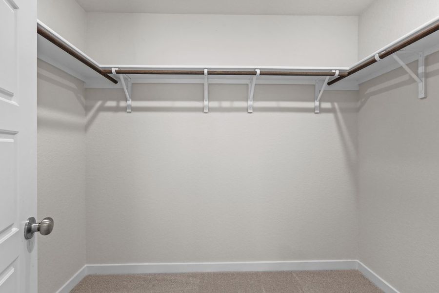 A white wall with a metal railing. A white wall with a metal railing.