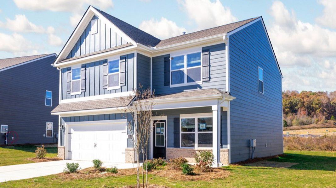 Front exterior of a new home in Prairie Pass, Apison, TN, highlighting curb appeal (Image 1). Front exterior of a new home in Prairie Pass, Apison, TN, highlighting curb appeal (Image 1).