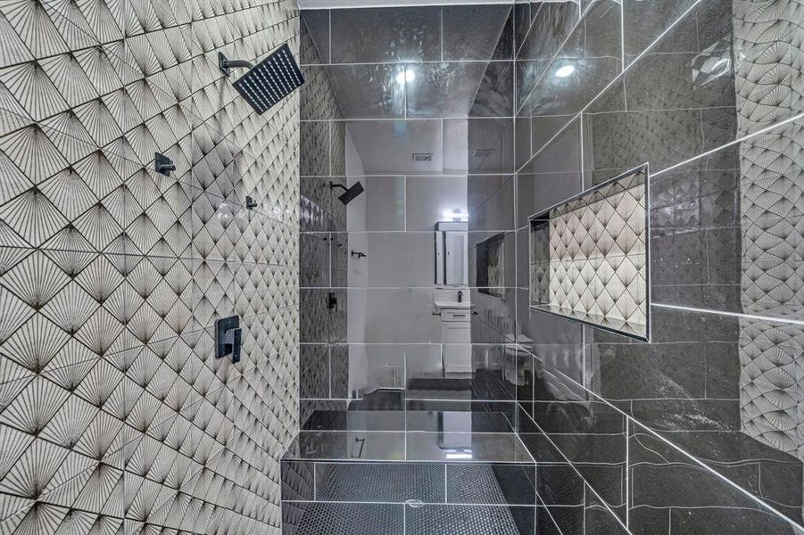 Bathroom with tiled shower