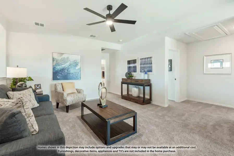 Living room with gray sofa, ceiling fan, carpet flooring, and wood coffee table Living room with gray sofa, ceiling fan, carpet flooring, and wood coffee table