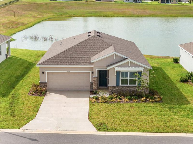 Front exterior of a new home in JB Ranch, Ocala, FL, highlighting curb appeal (Image 30). Front exterior of a new home in JB Ranch, Ocala, FL, highlighting curb appeal (Image 30).