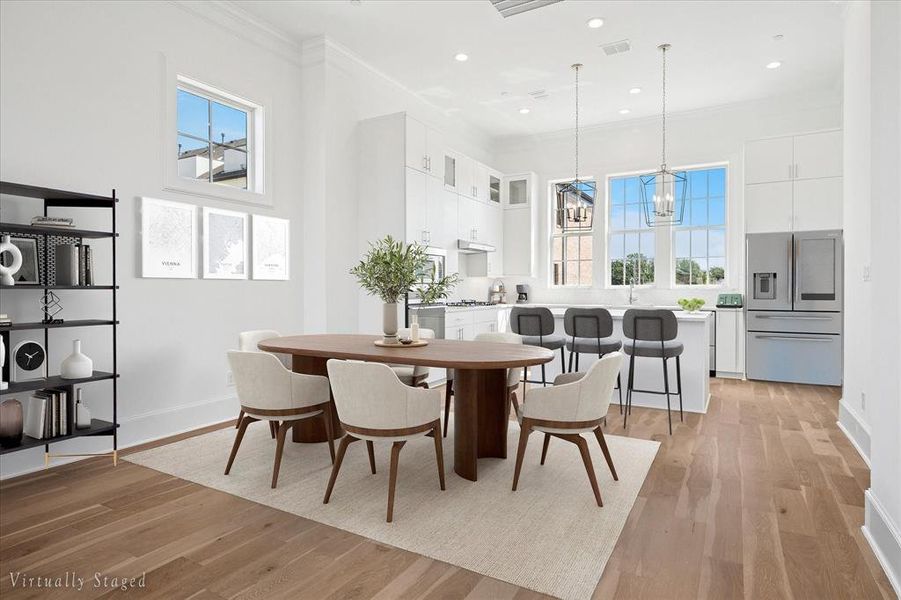 Open-concept living space with wide plank wood-finish flooring