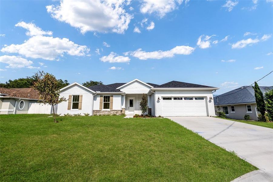 Front exterior of a new home in , Palm Coast, FL, highlighting curb appeal (Image 26).