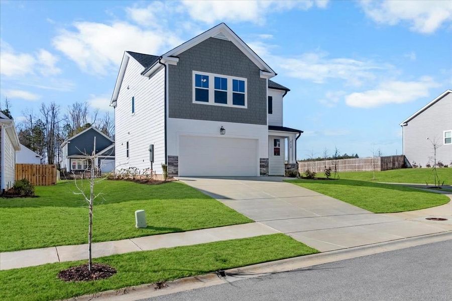 Front exterior of a new home in Tillery Park, Grovetown, GA, highlighting curb appeal (Image 24). Front exterior of a new home in Tillery Park, Grovetown, GA, highlighting curb appeal (Image 24).