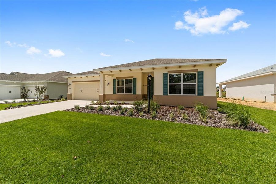 Front exterior of a new home in On Top of the World Communities, Ocala, FL, highlighting curb appeal (Image 19).