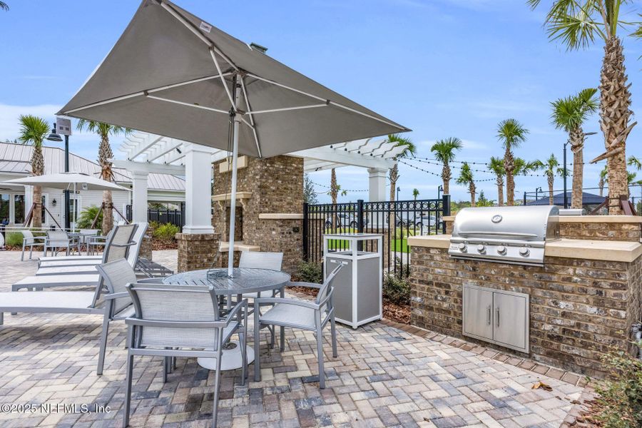 Front exterior of a new home in Summer Bay at Grand Oaks, St. Augustine, FL, highlighting curb appeal (Image 26).