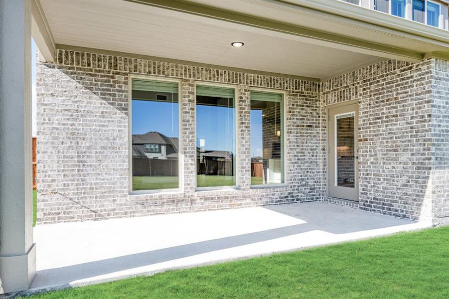 Exterior details and patio area of a home in Terracina, Rockwall (Image 4). Exterior details and patio area of a home in Terracina, Rockwall (Image 4).