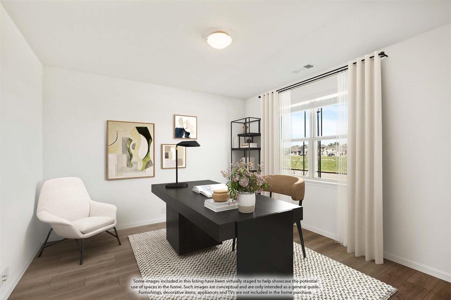 Home office with dark wood desk, hardwood floors, and large window with white curtains