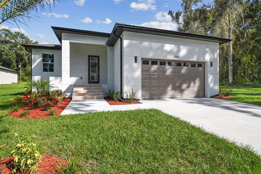 Front exterior of a new home in , Brooksville, FL, highlighting curb appeal (Image 26).