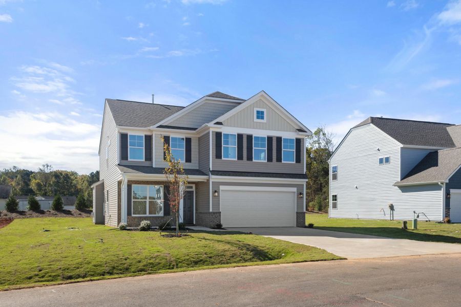Front exterior of a new home in Pisgah Park, Kernersville, NC, highlighting curb appeal (Image 21).