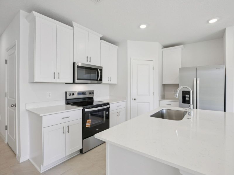 Furnished interior view inside a new home in The Reserve at Hammock Oaks Townes, Lady Lake (Image 4).