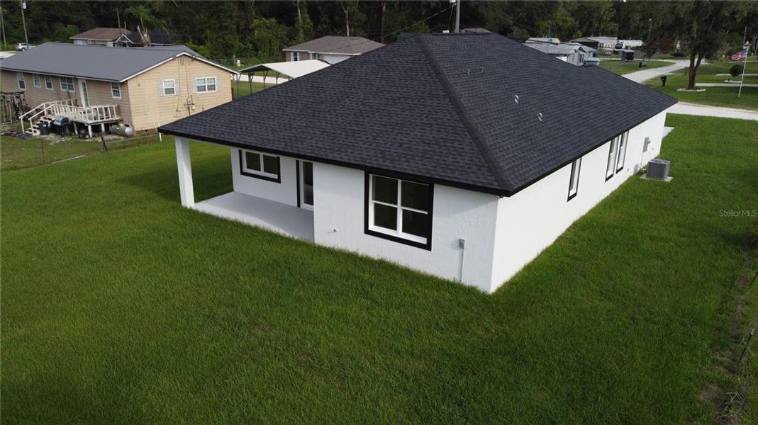 Exterior details and patio area of a home in , Summerfield (Image 36).