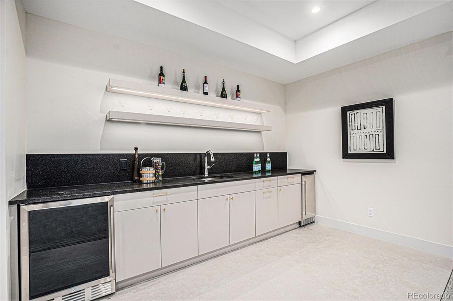 Basement wet bar with drink cooler