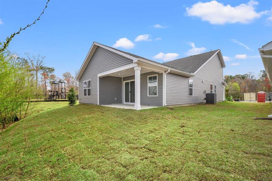 Exterior details and patio area of a home in Meadows Edge, Conway (Image 3).