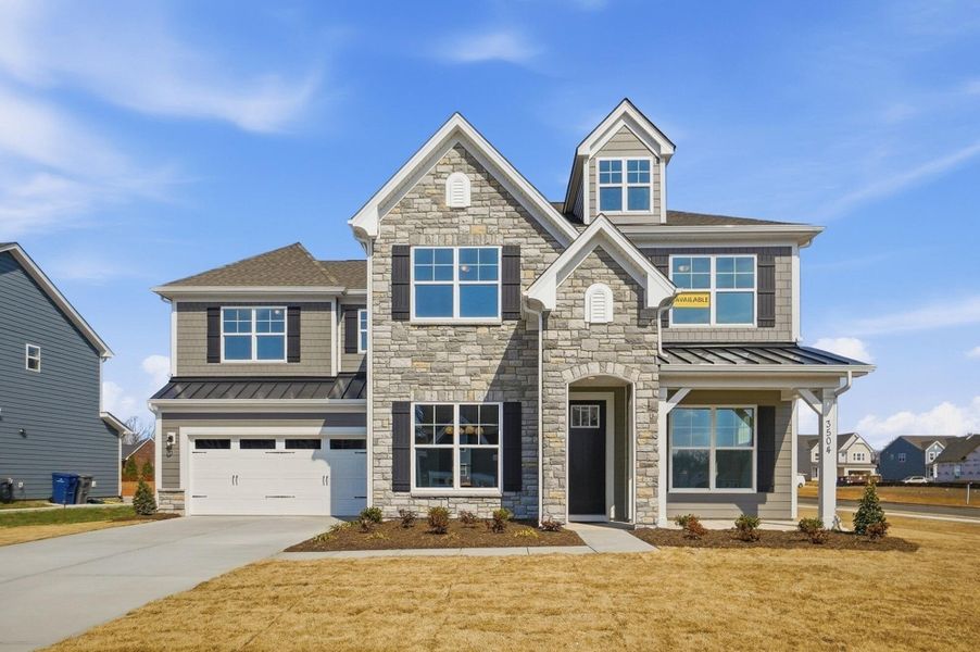 Front exterior of a new home in Harmony, Harrisburg, NC, highlighting curb appeal (Image 1). Front exterior of a new home in Harmony, Harrisburg, NC, highlighting curb appeal (Image 1).