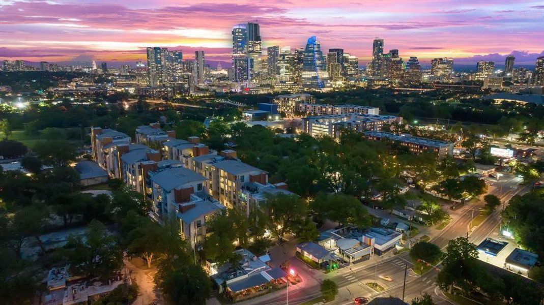 Evening view of the park, lake & downtown from the Barton Springs Road facade of Barton Place