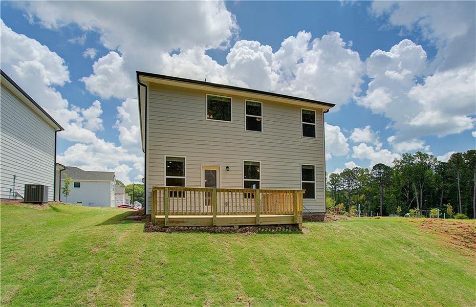 Exterior details and patio area of a home in Enclave at Evergreen, Fairburn (Image 3).
