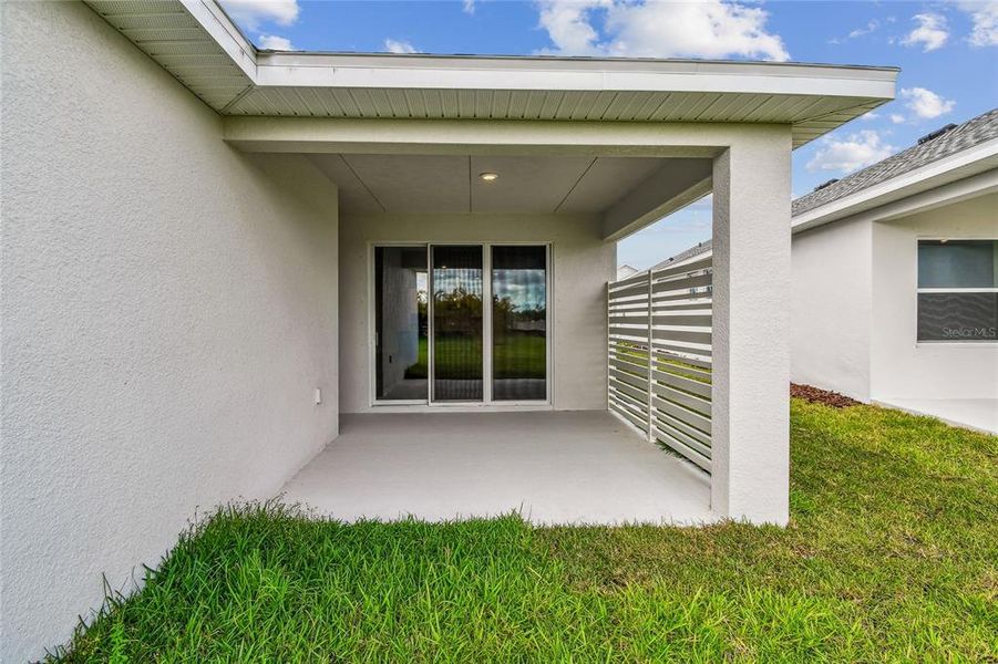 Exterior details and patio area of a home in North River Ranch – Garden Series, Parrish (Image 24).