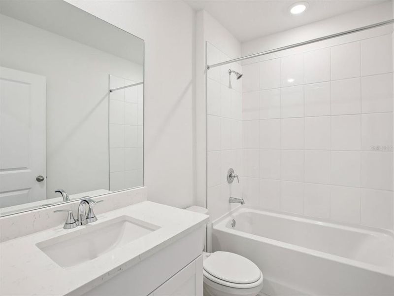 Furnished interior view inside a new home in The Grove at Stuart Crossing - Classic Series, Bartow (Image 4).