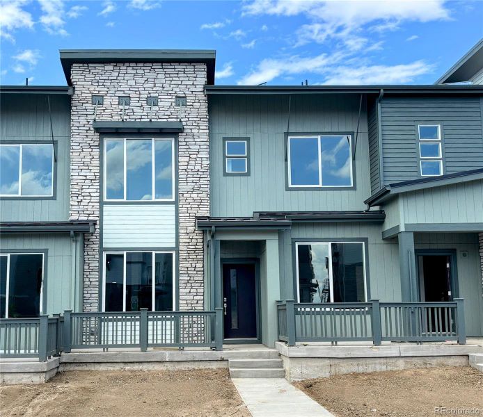 Front exterior of a new home in Vermilion Creek: The Parkside Collection, Centennial, CO, highlighting curb appeal (Image 11).