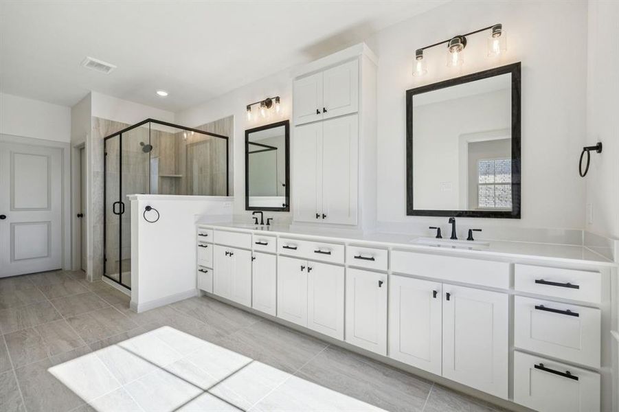 Filled with style, sophistication and space, this fantastic Owner's bath was built for two!