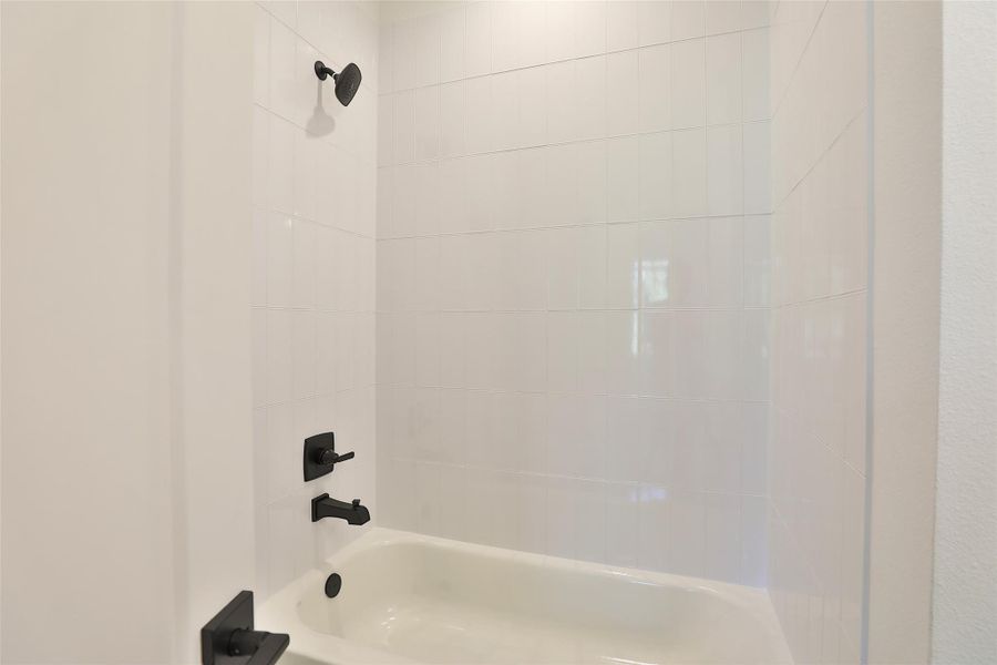 Full ensuite bathroom with combo shower and soaking tub.