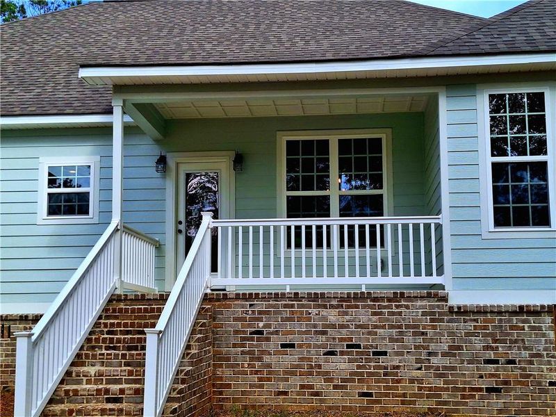 Front exterior of a new home in , Milledgeville, GA, highlighting curb appeal (Image 22).