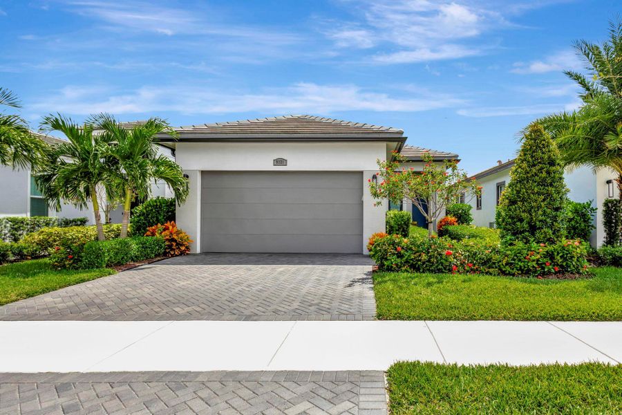 Front exterior of a new home in , Port St. Lucie, FL, highlighting curb appeal (Image 23).
