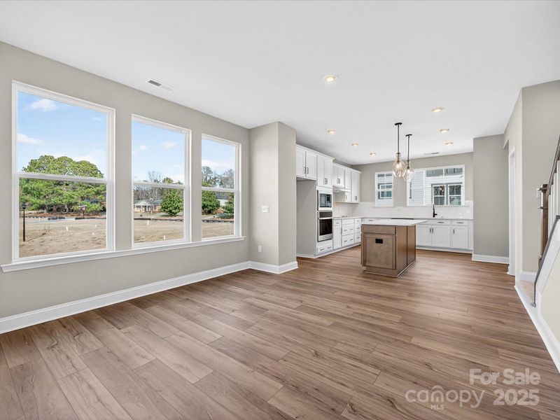 Dining Space with Wall of Windows and Filled with Light.