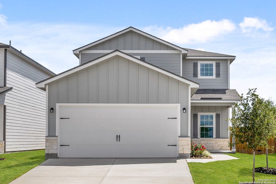 Front exterior of a new home in Blue Wing, San Antonio, TX, highlighting curb appeal (Image 1). Front exterior of a new home in Blue Wing, San Antonio, TX, highlighting curb appeal (Image 1).
