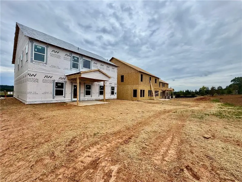 Exterior details and patio area of a home in Eastlyn Crossing, Flowery Branch (Image 3). Exterior details and patio area of a home in Eastlyn Crossing, Flowery Branch (Image 3).