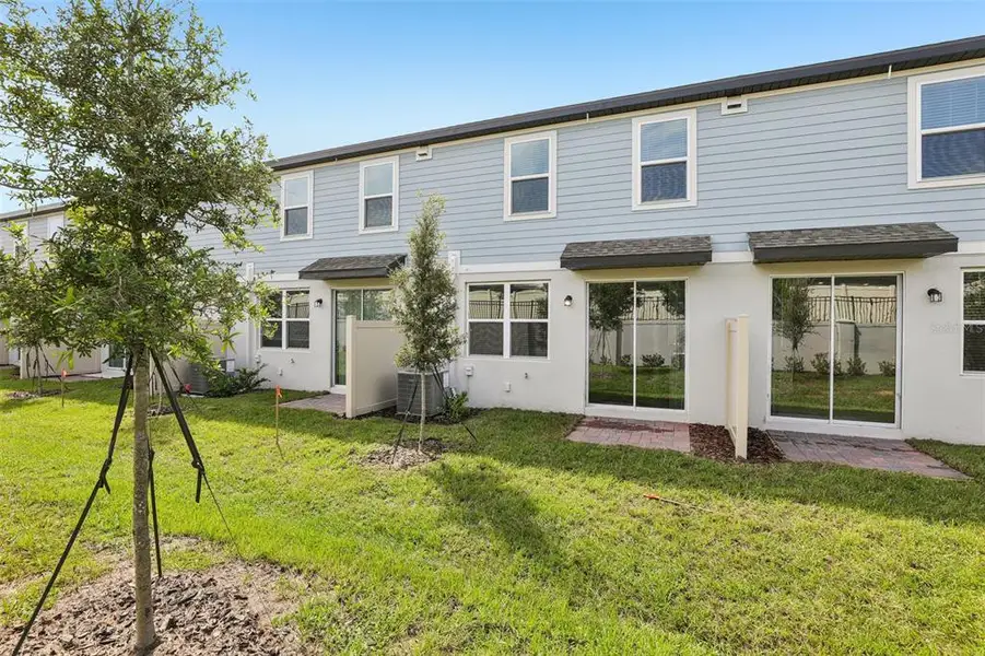 Exterior details and patio area of a home in Cagan Crossings West, Clermont (Image 3).
