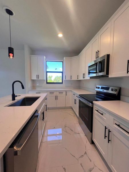 Furnished interior view inside a new home in , Port Charlotte (Image 12).