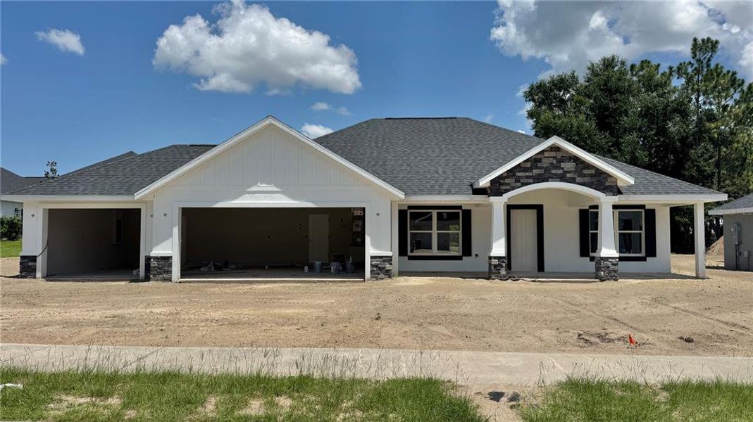 Front exterior of a new home in , Dunnellon, FL, highlighting curb appeal (Image 2).