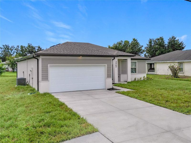 Front exterior of a new home in , North Port, FL, highlighting curb appeal (Image 25). Front exterior of a new home in , North Port, FL, highlighting curb appeal (Image 25).