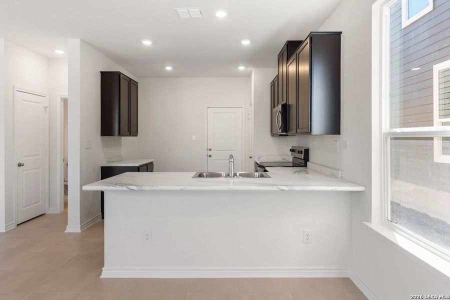 Furnished interior view inside a new home in Spanish Trails Villas, San Antonio (Image 12).