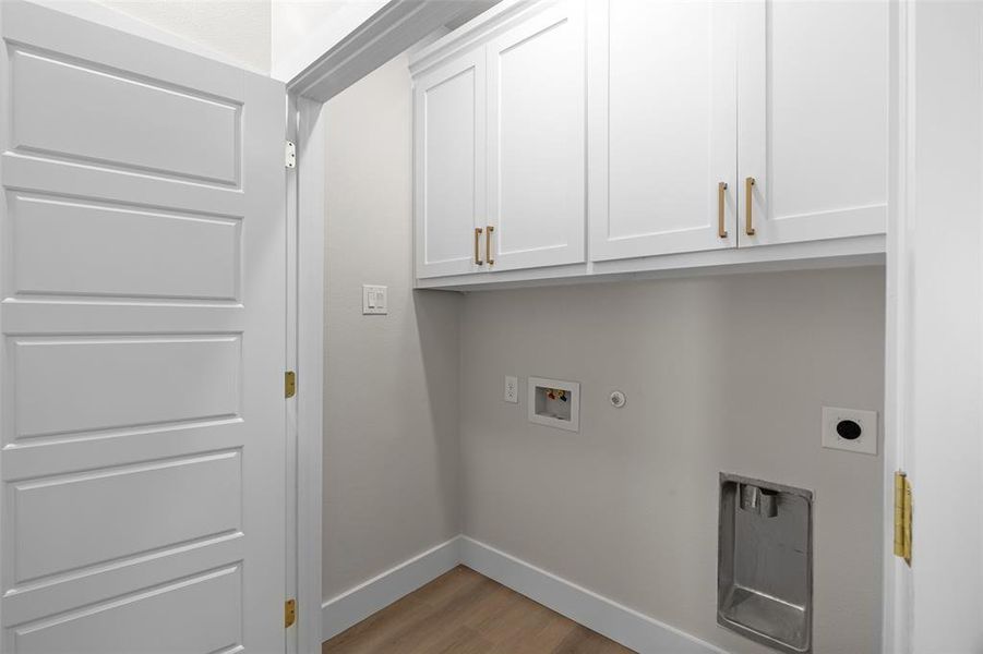 Utility room with cabinets