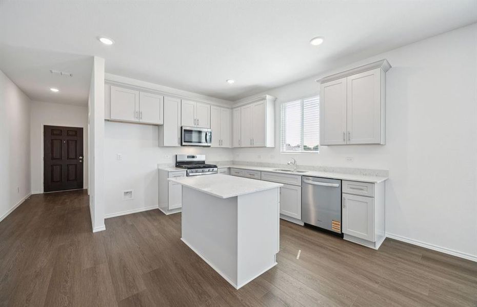 Island overlooking gathering room and dining area Island overlooking gathering room and dining area