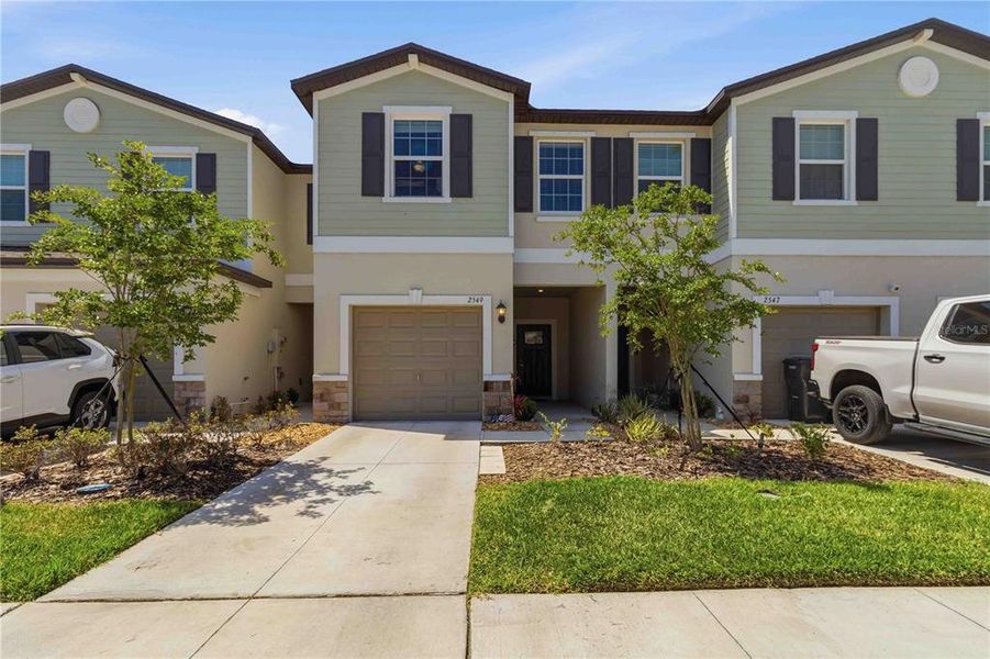Front exterior of a new home in , Ruskin, FL, highlighting curb appeal (Image 2).