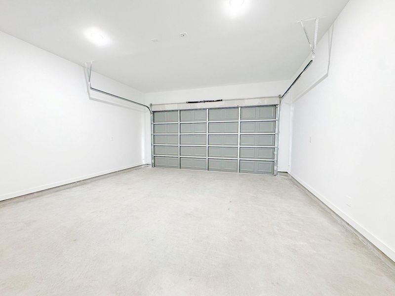 A spacious garage offers plenty of room for vehicles and storage, combining convenience with practicality. A spacious garage offers plenty of room for vehicles and storage, combining convenience with practicality.