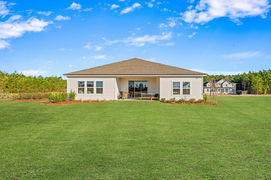 A house with a grass yard.