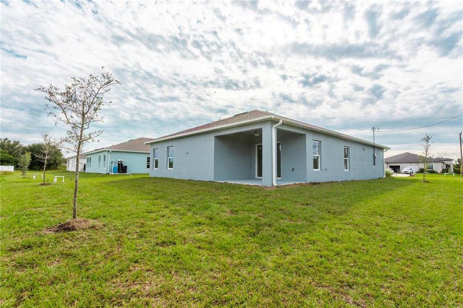 Front exterior of a new home in , Lehigh Acres, FL, highlighting curb appeal (Image 23). Front exterior of a new home in , Lehigh Acres, FL, highlighting curb appeal (Image 23).