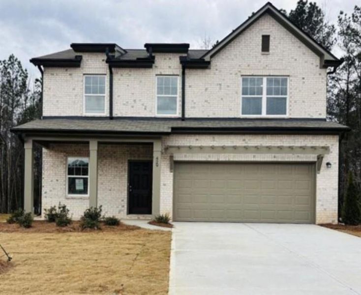 Front exterior of a new home in Kendall Grove, McDonough, GA, highlighting curb appeal (Image 1). Front exterior of a new home in Kendall Grove, McDonough, GA, highlighting curb appeal (Image 1).