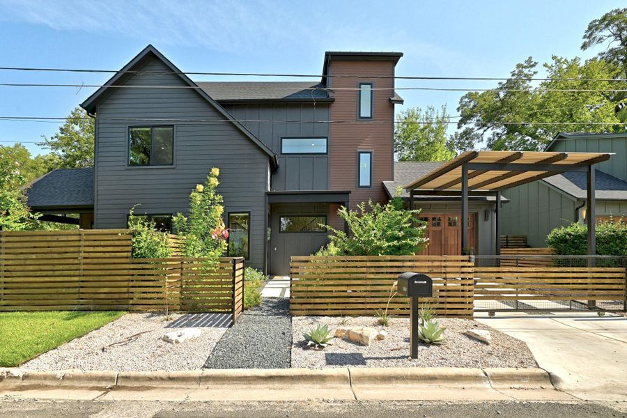 Front of home with full fence Front of home with full fence