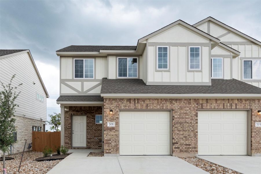 Front exterior of a new home in Saddle Creek Twinhomes, Georgetown, TX, highlighting curb appeal (Image 24).