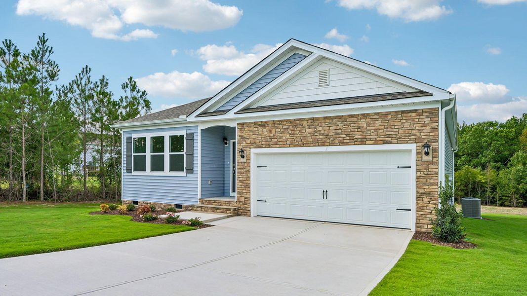 Front exterior of a new home in Baker Farm, Youngsville, NC, highlighting curb appeal (Image 14).