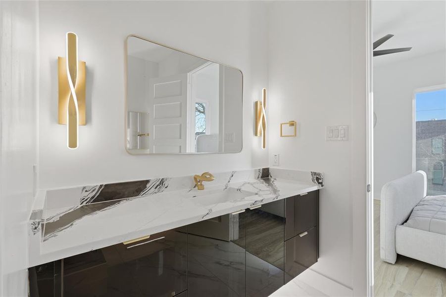 Ensuite bathroom with vanity and healthy amount of natural light Ensuite bathroom with vanity and healthy amount of natural light